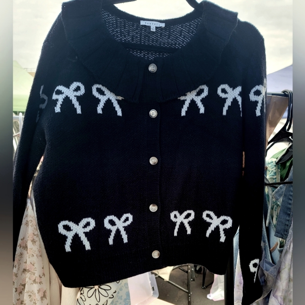 Black Sweater with White Bow Accents